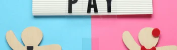 equal pay sign with man in tie figure and woman in dress