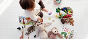 educational playtime with toddler on floor with toys