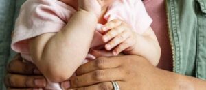 baby and mum cuddling