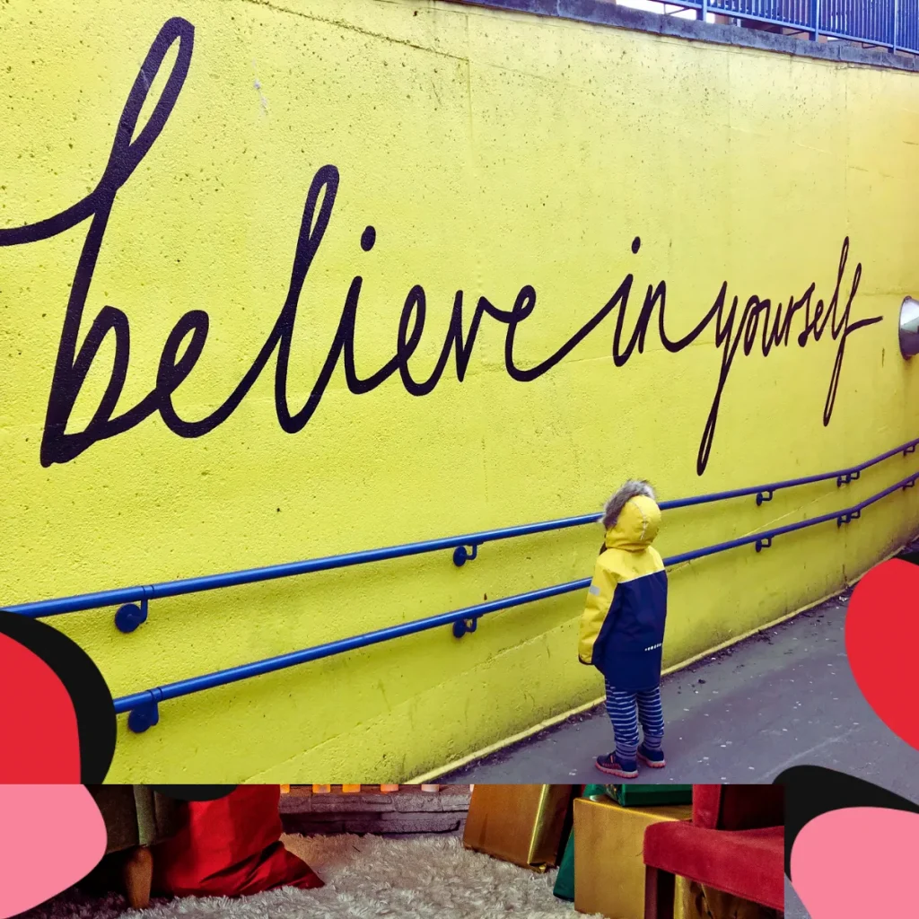 believe in yourself written on a yellow wall
