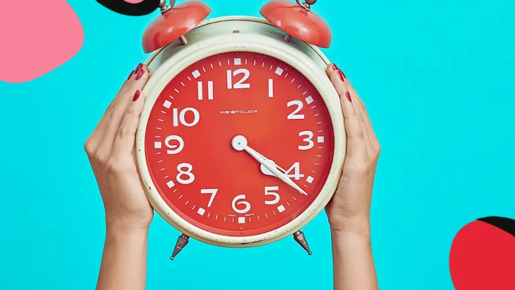woman holding clock up above her head to show flexible working