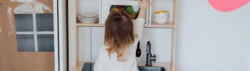 preschooler playing in a montessori functional kitchen
