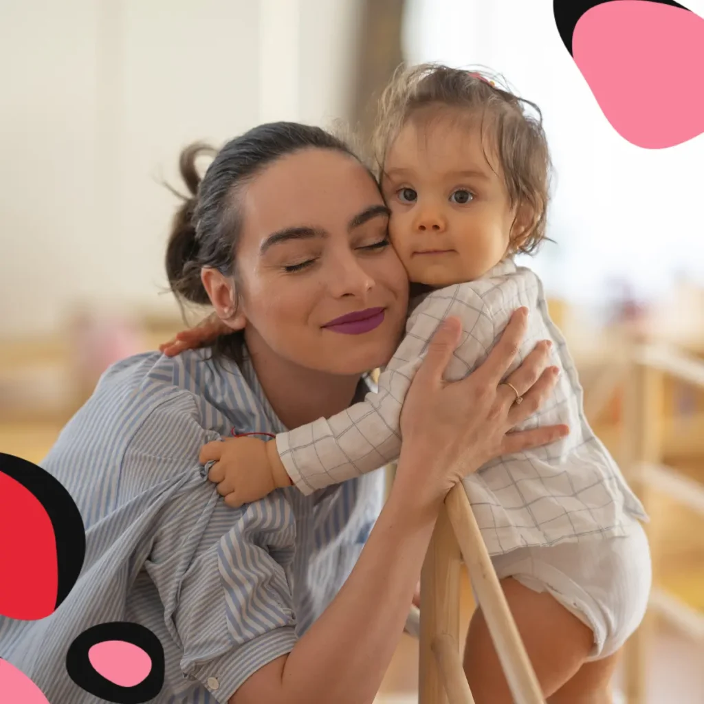 mum hugging toddler on a montessori arch and montessori climbing toys 