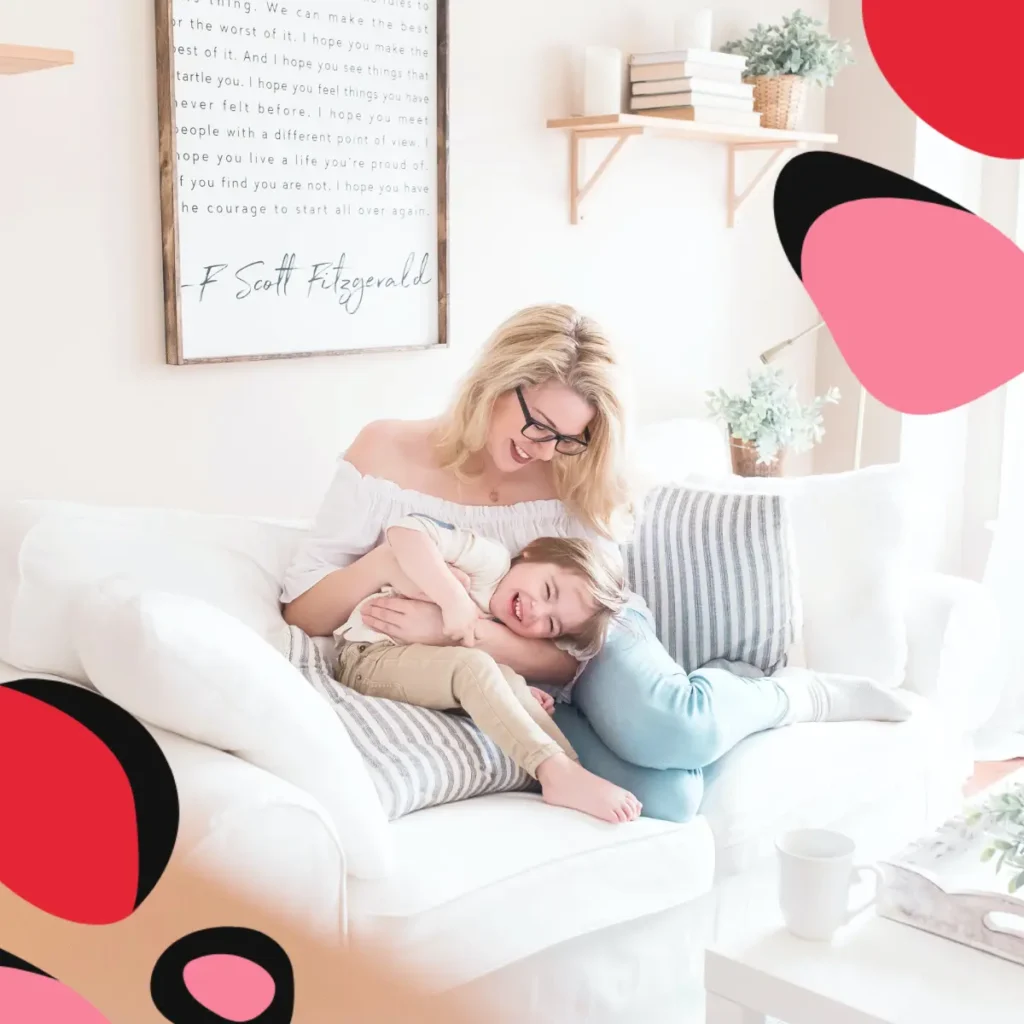 Turn Your Living Room Into A Social Space This Winter with a mum and daughter laughing on the couch