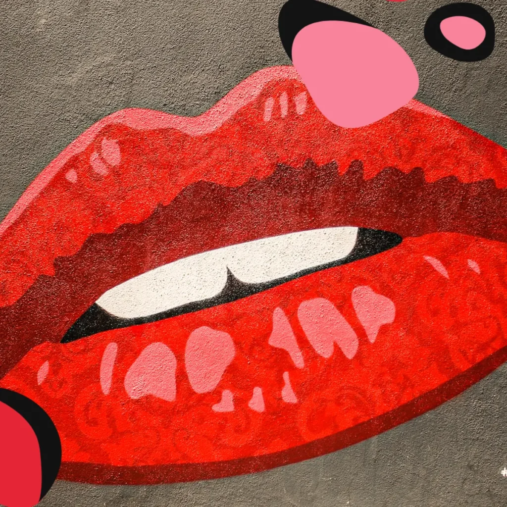 pair of painted lips on a wall bright red as a marketing campaign