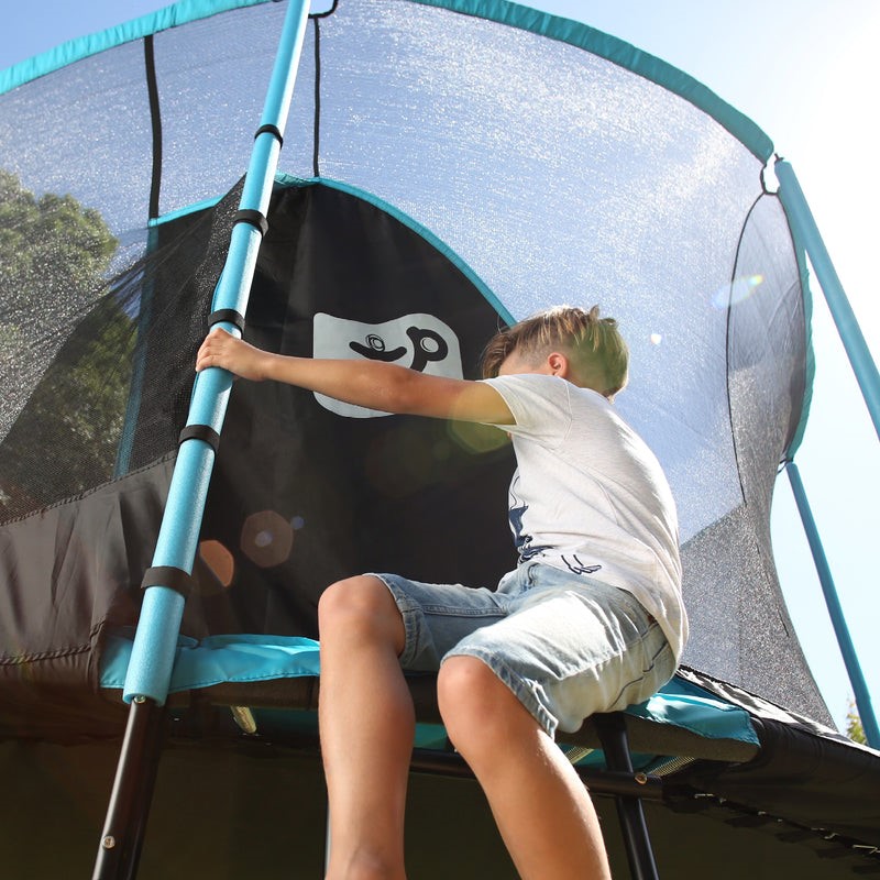 boy getting on a trampoline