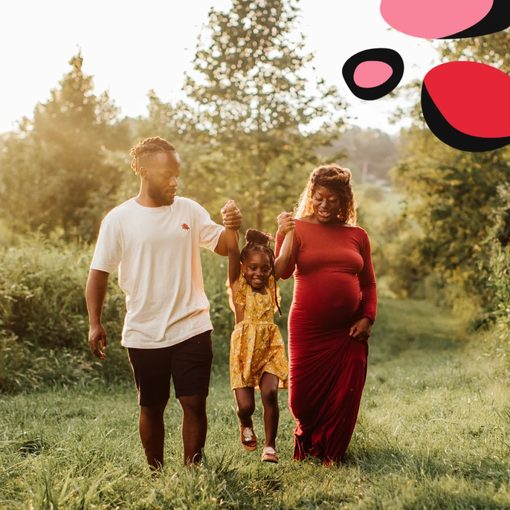 maternity photoshoot with toddler with family mum and dad and toddler outside