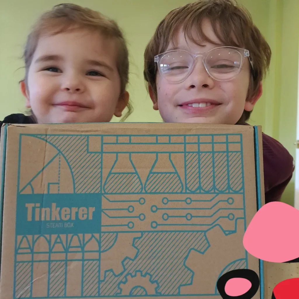 review of the Tinkerer STEAM box with two children holding