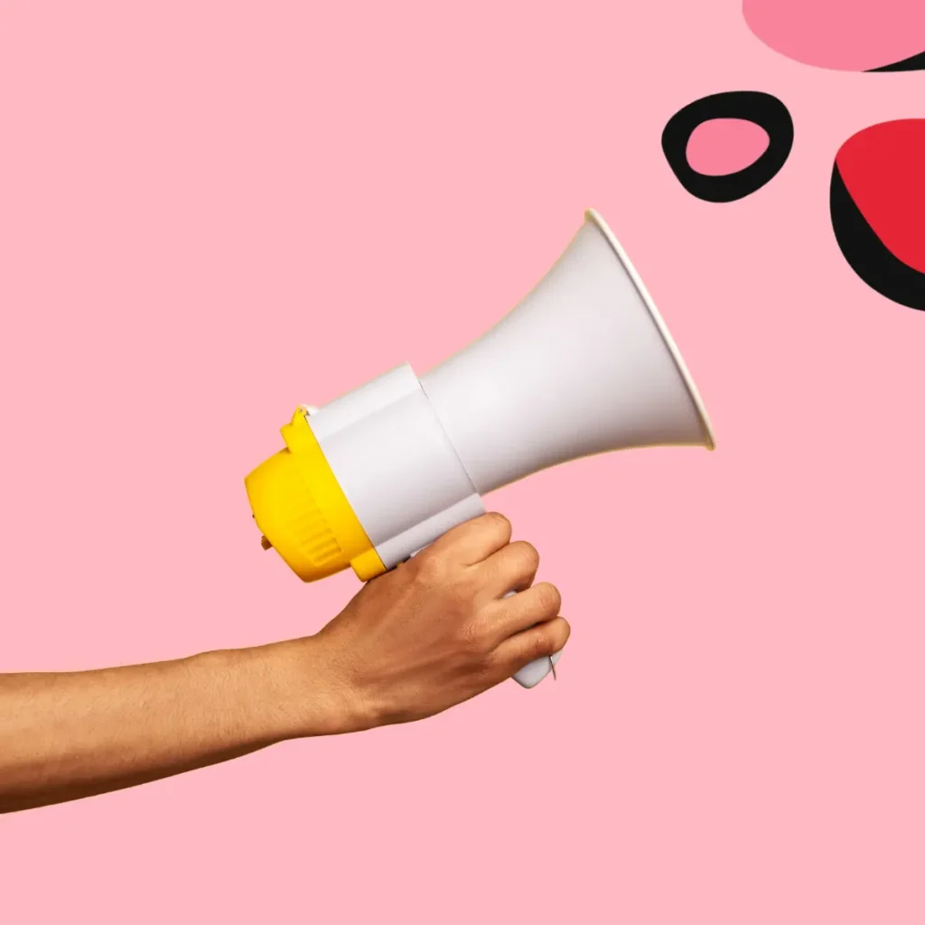 megaphone on pink background showing Outdoor Marketing Strategies for Small Businesses