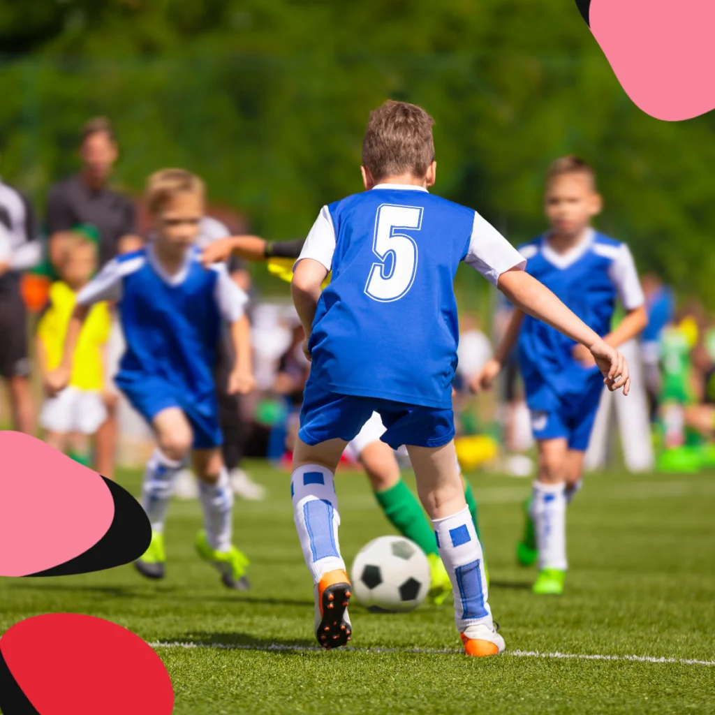 young kids playing football show how Families Are Combining Vacations with Sports Camps 