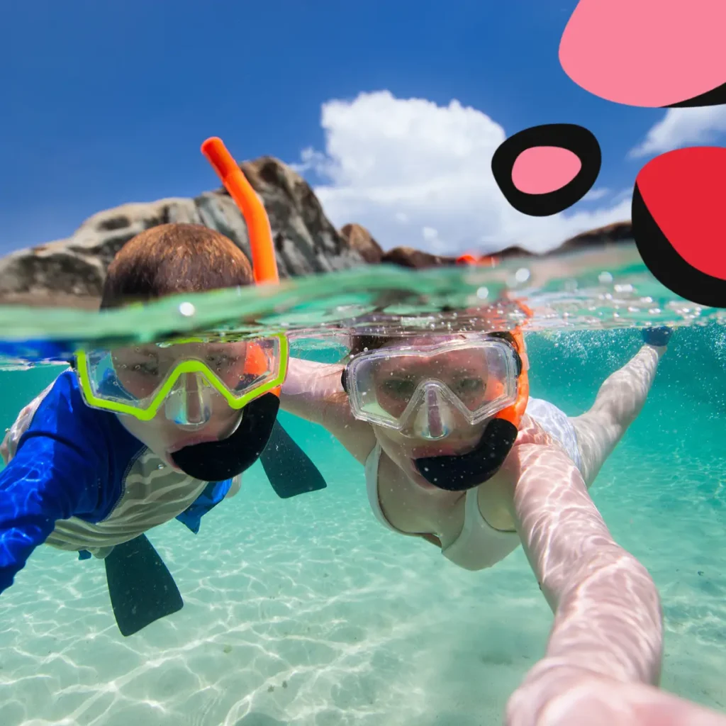 Tips on Planning a Family Holiday with mum and child snorkling in the sea