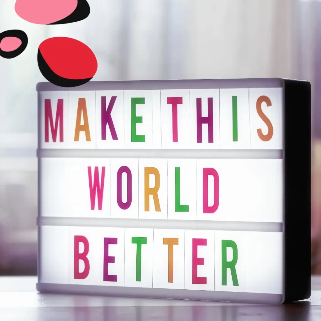 sign saying make this world better in different colour letters