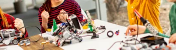 kids playing with tech toys for christmas