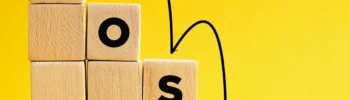 small business costs against a yellow back ground with costs written on cubes on the stairs