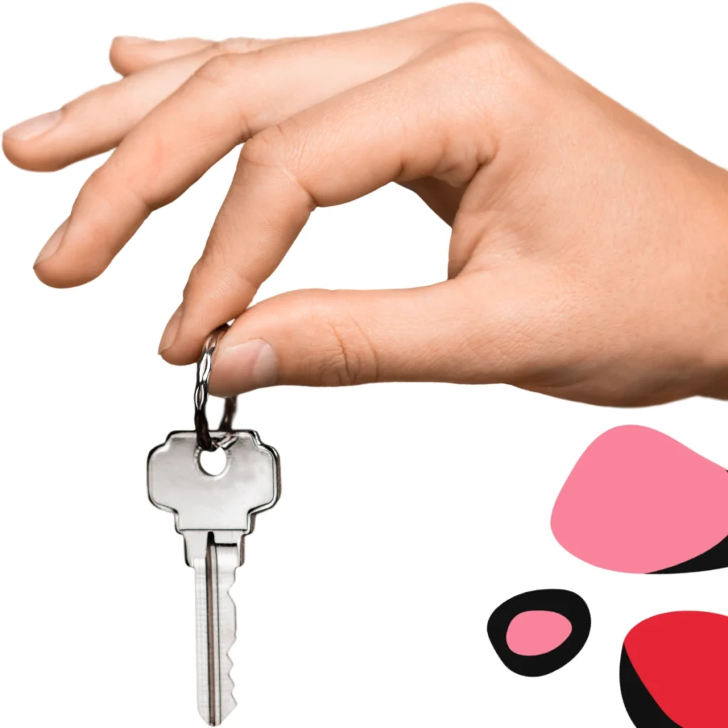 womans hands holding a key