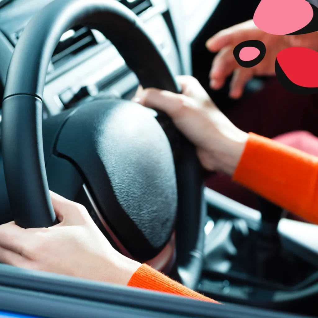 woman on driving lesson holding wheel
