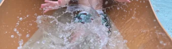 kimi coming out the bottom of a slide with huge splash at the sandcastle blackpool