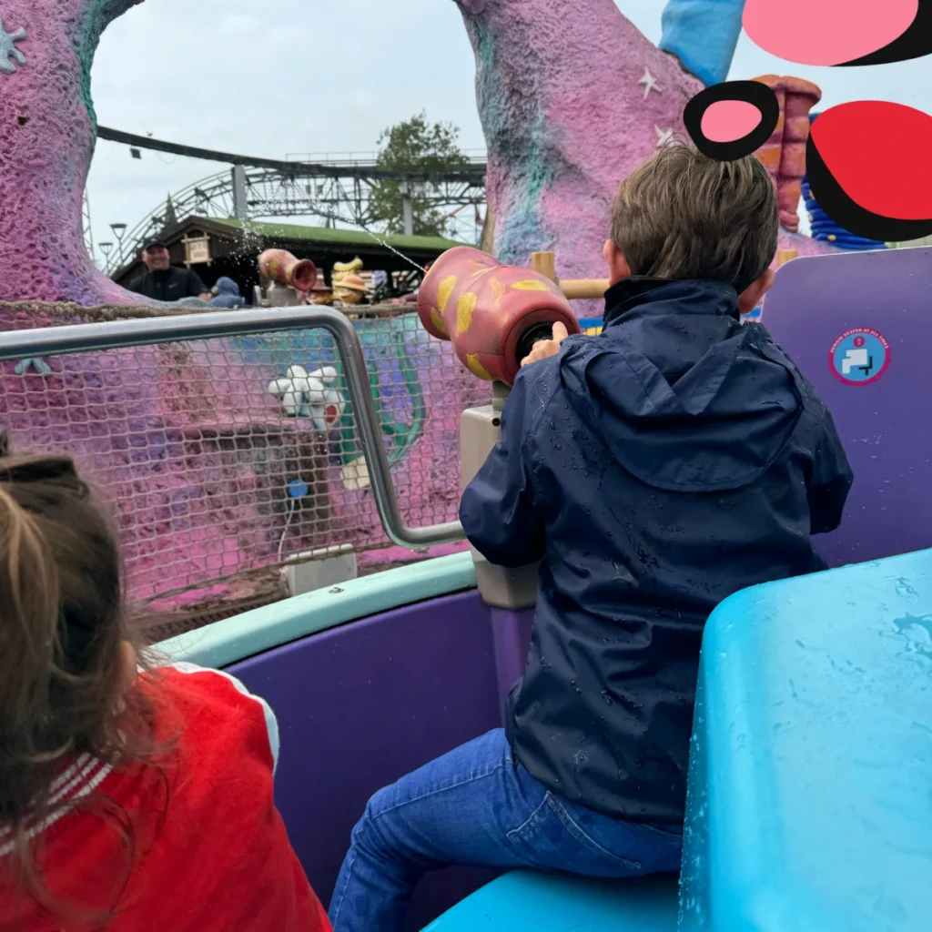 spraying the water cannons at the crowds on a ride at blackpool pleasure beach
