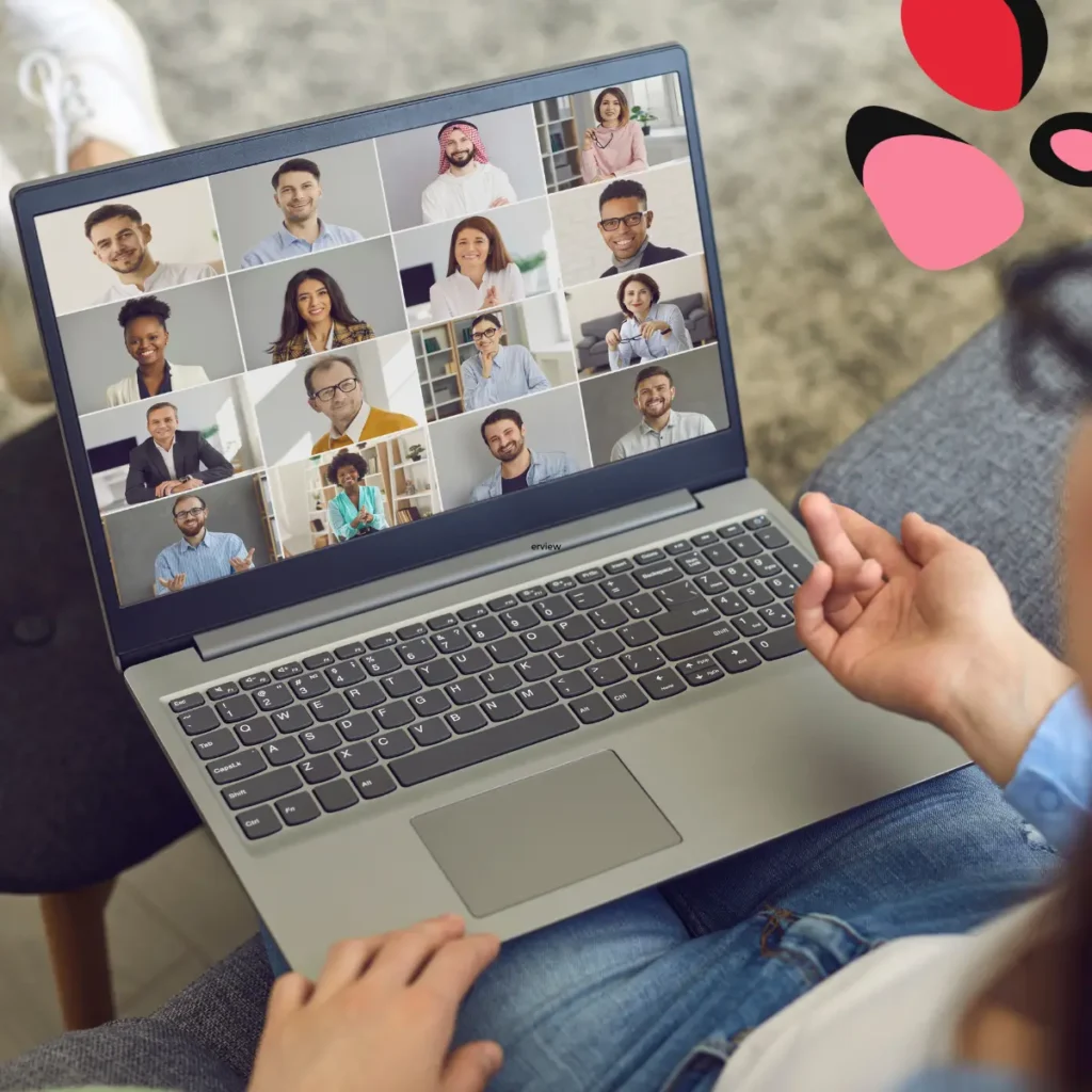 woman with laptop on her knee showing a virtual team bonding meeting