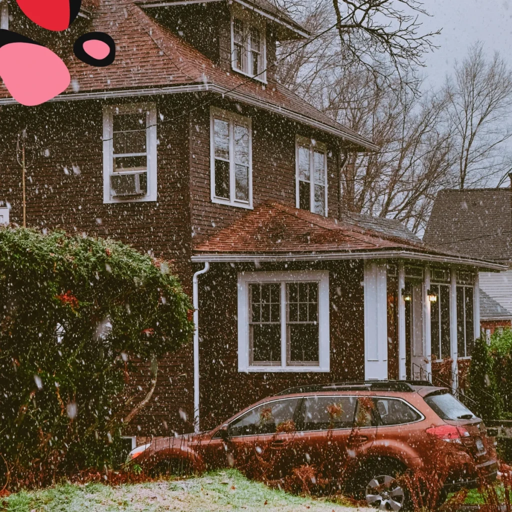 picture of house in the uk in winter weather from the outside some snow falling