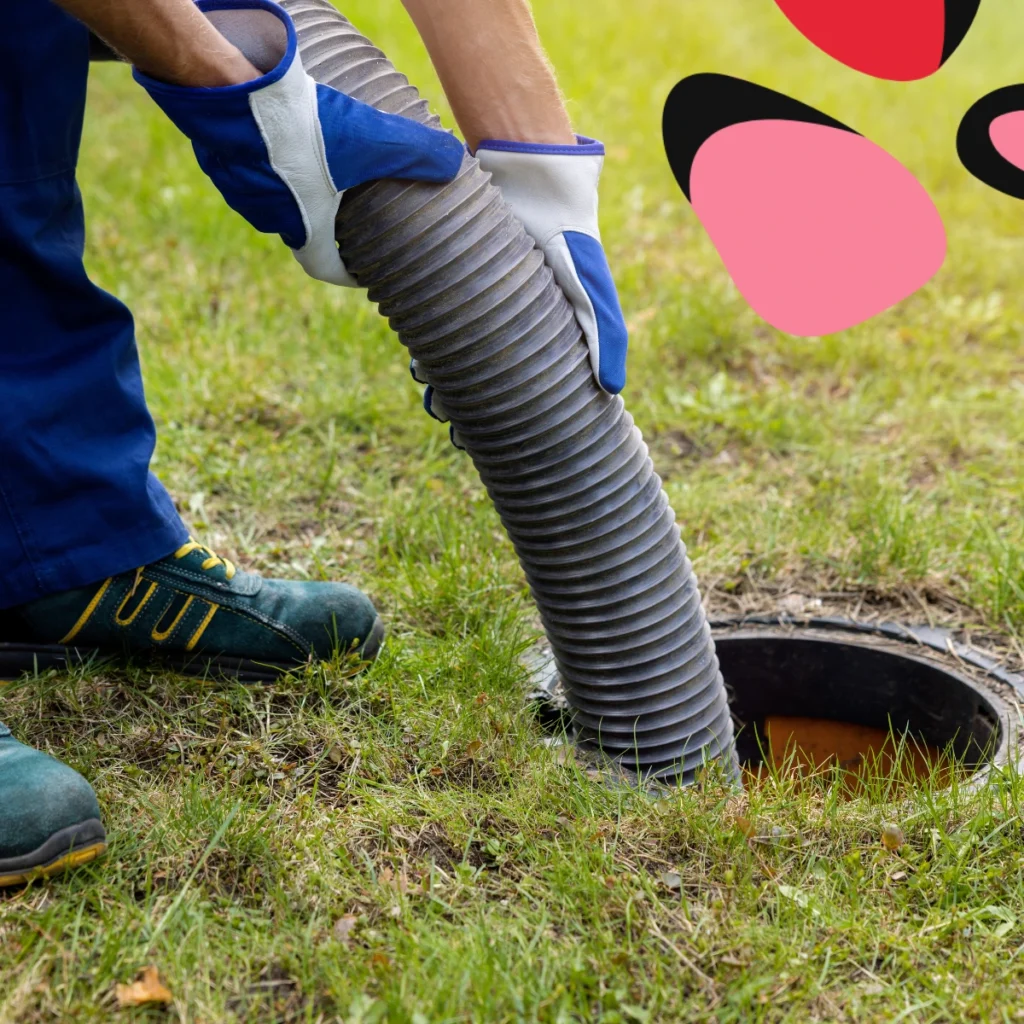 man putting sewage pipe in the ground
