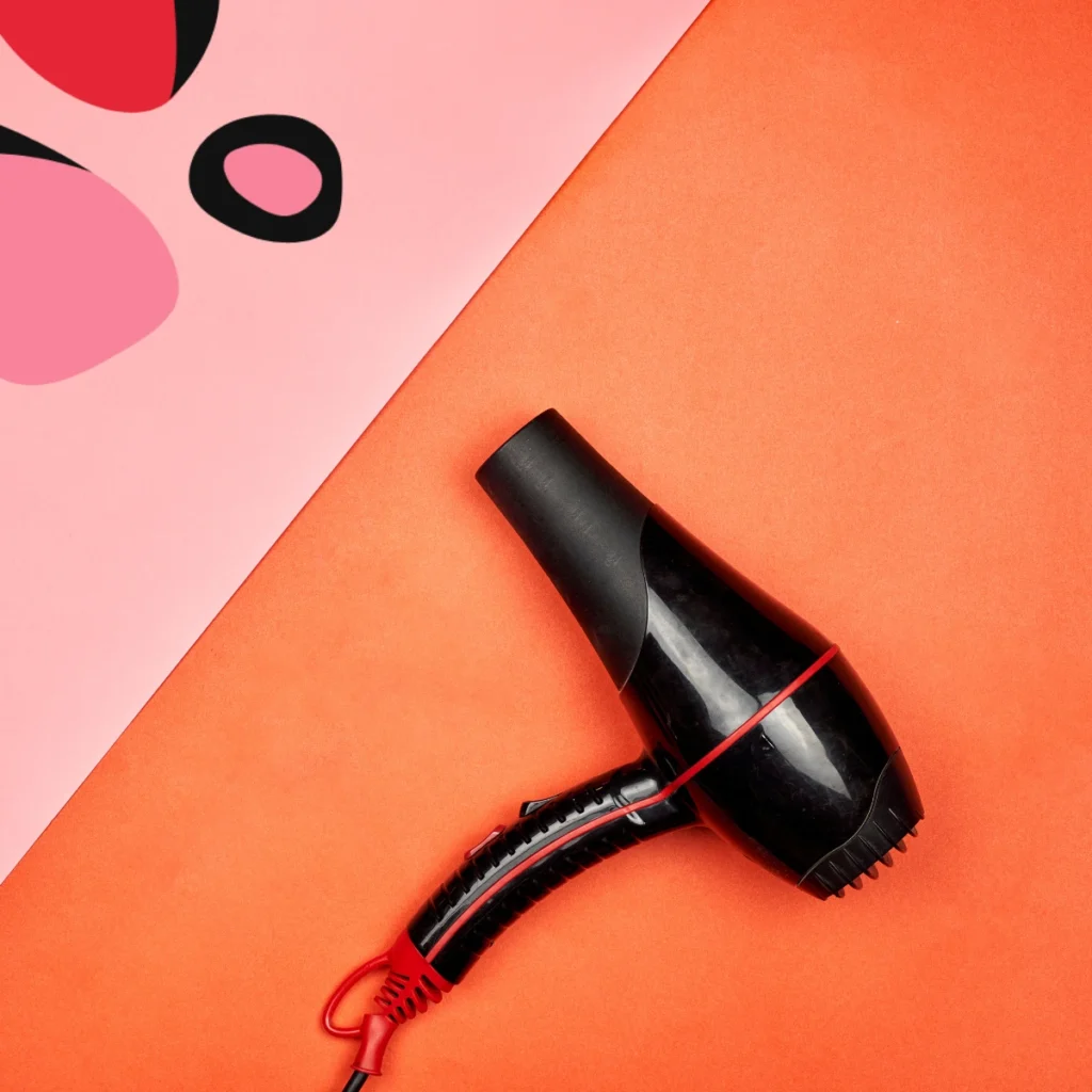 hairdryer on a pink and orange background