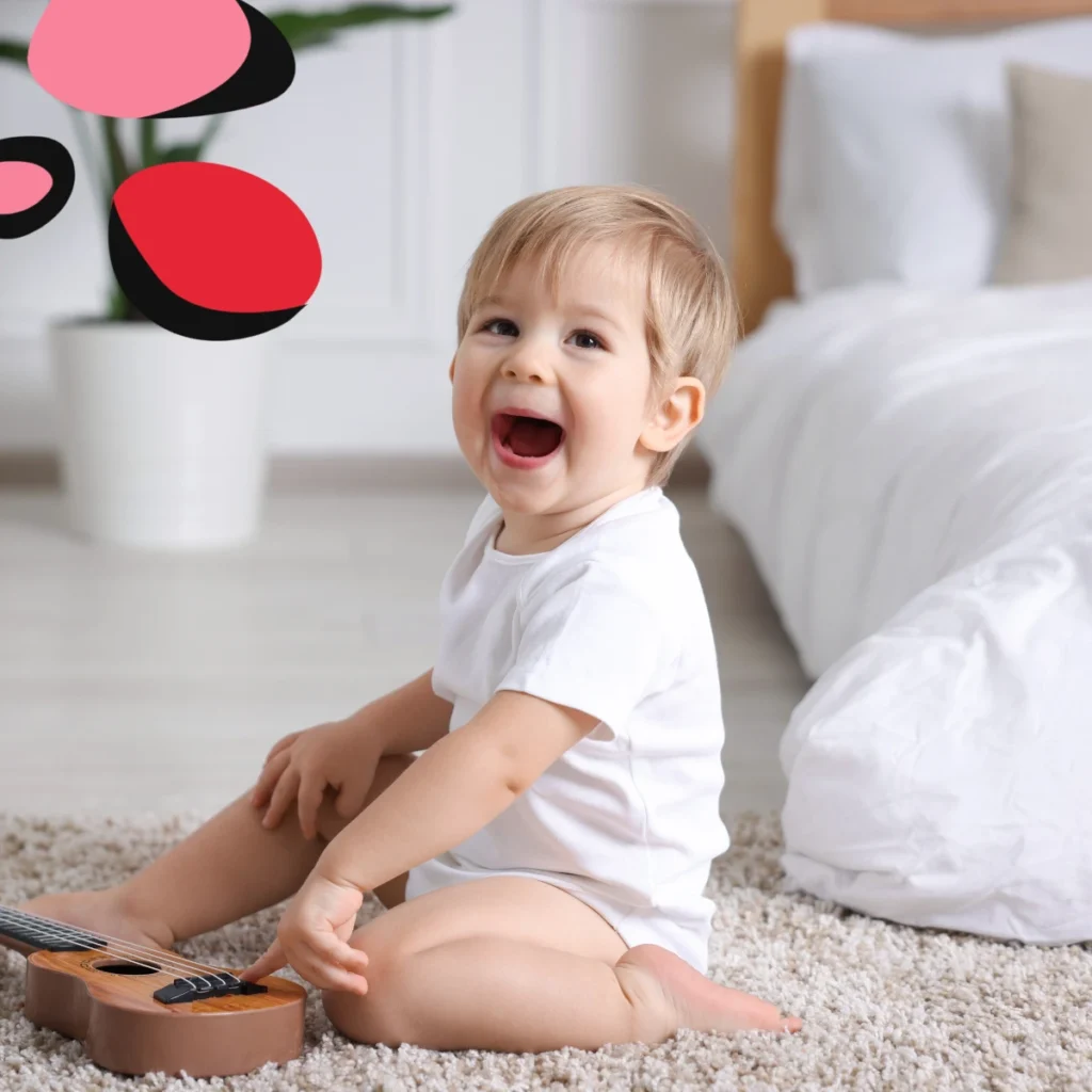 toddler sat by a montessori bed