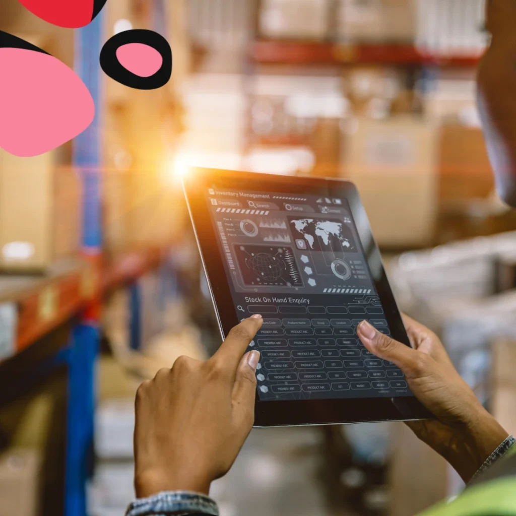 MAN HOLDING A CMMS SYSTEM ON A TABLET