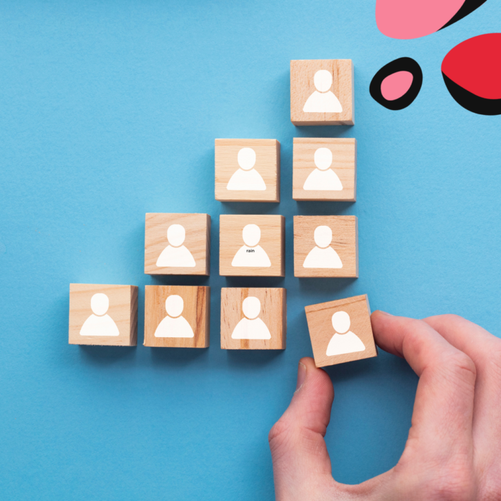 people figures on wonder blocks in a triangle with on being taken away for payroll