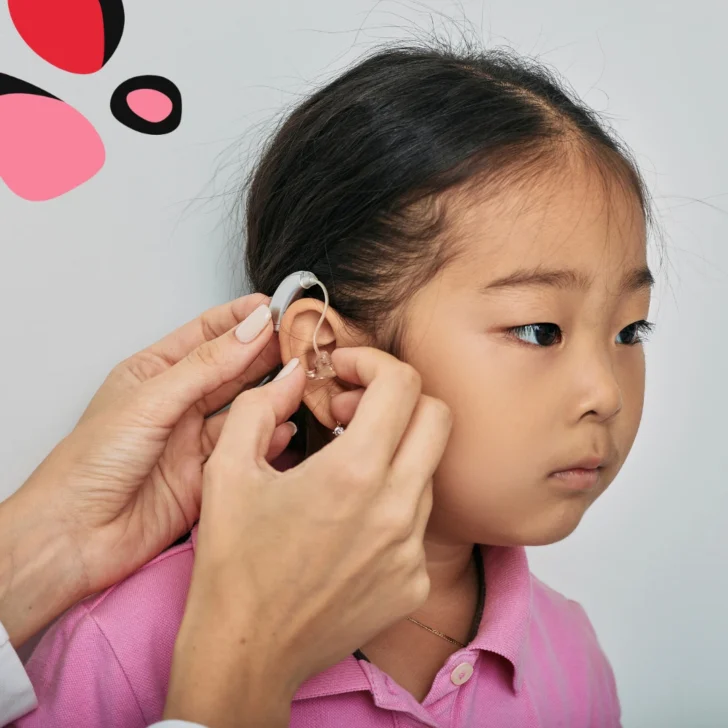 little girl getting hearing aid fitted